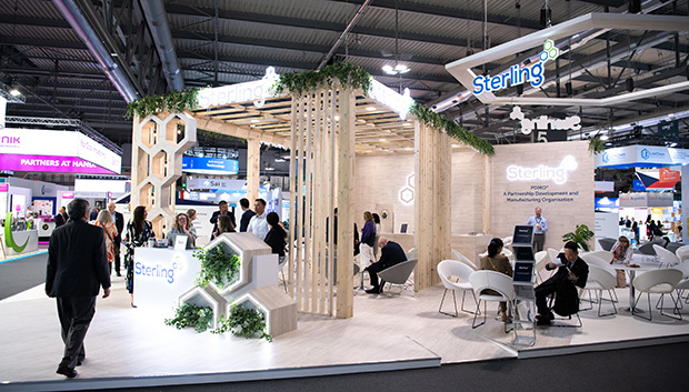 Pharma professional showcasing products at exhibition