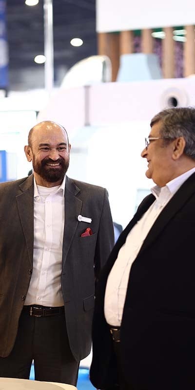 Men seated wearing VR headsets