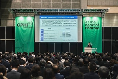 Group of pharma professionals cutting the ribbon at CPHI Japan event